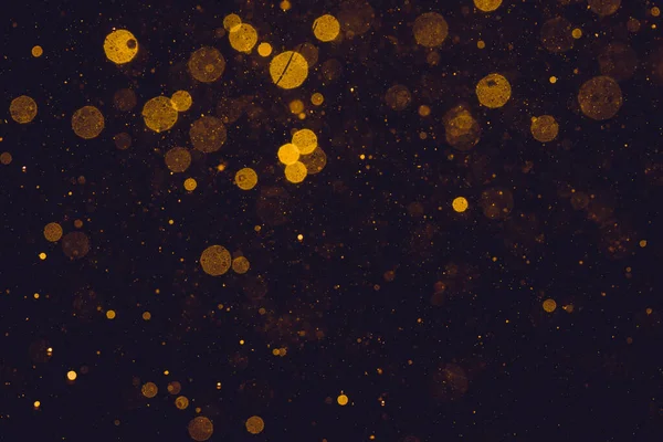 Gold Bokeh Lights Black Background — Fotografia de Stock