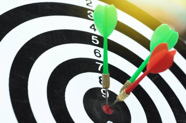 Successful business planning with a goal that has an arrow in the center of the target.