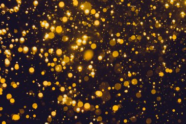 Siyah arkaplan ile soyut altın bokeh