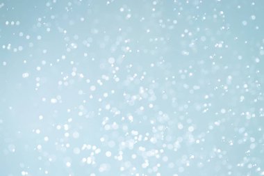 Mavi arkaplan ile soyut beyaz bokeh