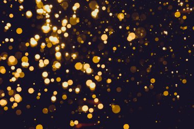 Siyah arkaplan ile soyut altın bokeh