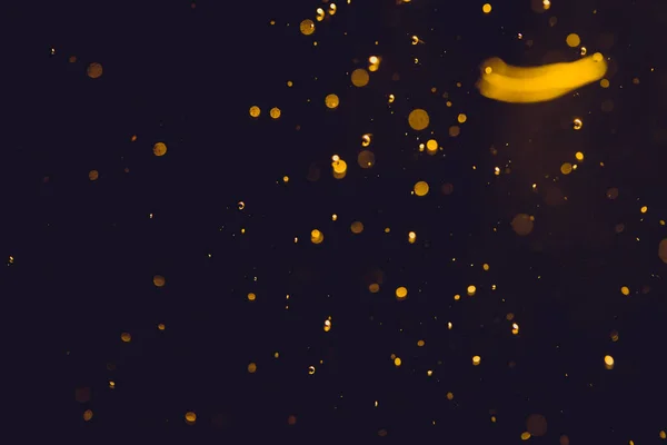 Siyah Arkaplanda Koyu Soyut Altın Bokeh Parıltısı — Stok fotoğraf