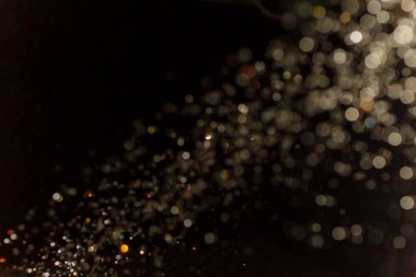 Siyah arkaplanda ışık bokeh