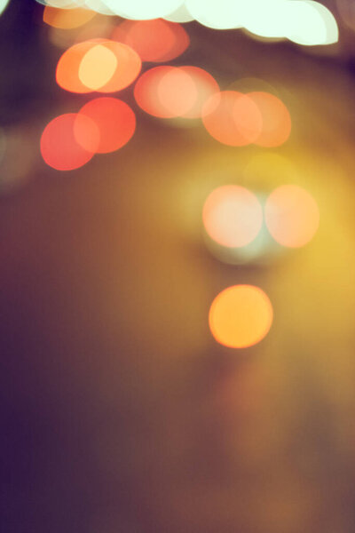 Abstract defocus of bokeh light traffic in the city background