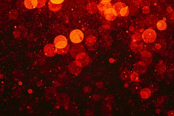 黒い背景のライトの赤いボケ — ストック写真
