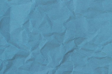 Kırışıklık arkaplanı olan mavi kağıt