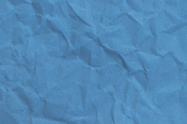 Kırışıklık arkaplanı olan mavi kağıt