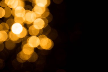 Siyah arkaplan ile soyut altın bokeh