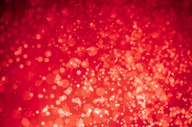 Soyut kırmızı noel simli ışıklar Bokeh arkaplanının odaklanmasını engeller