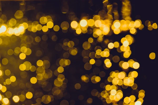 Siyah arkaplan ile soyut altın bokeh