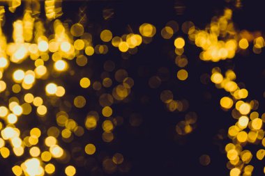 Siyah arkaplan ile soyut altın bokeh