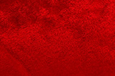Kırmızı lüks yün doğal tüylü kürk derisi. Arka plan ve duvar kağıdı için yakın çekim dokusu.