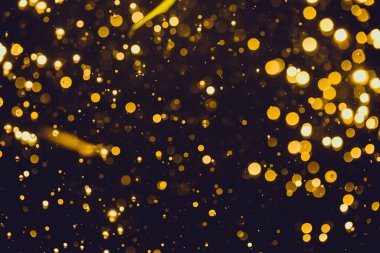 Siyah arkaplan ile soyut altın bokeh