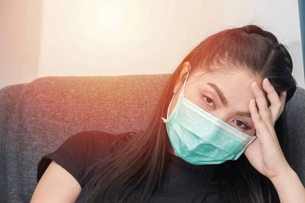 Asian woman wears a medical mask to protect against Covid\'s disease.