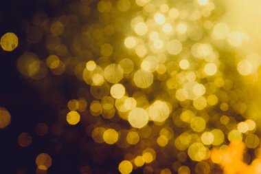 Soyut dekorasyon Bokeh bayramında siyah arka planda parlayan ışıklar