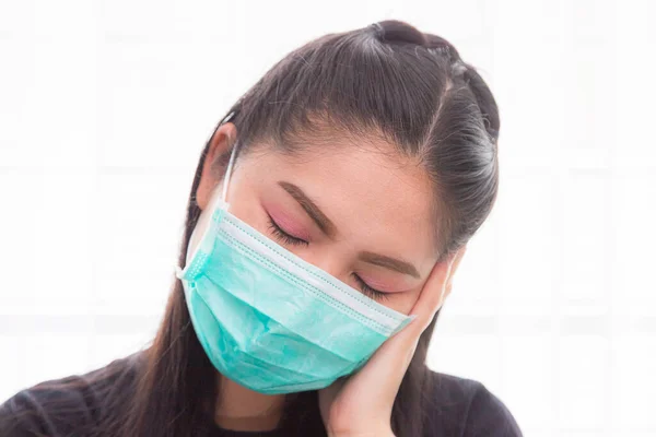 Asian woman wears a medical mask to protect against Covid\'s disease.