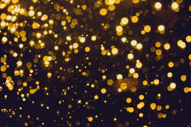 Siyah arkaplan ile soyut altın bokeh