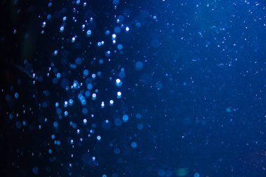 Abstract blue defocus bokeh glitter vintage lights with black background