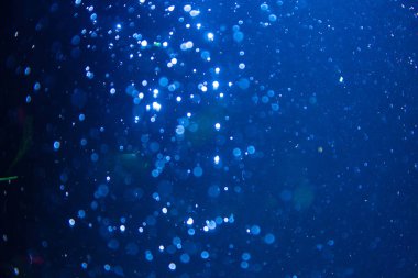 Abstract blue defocus bokeh glitter vintage lights with black background