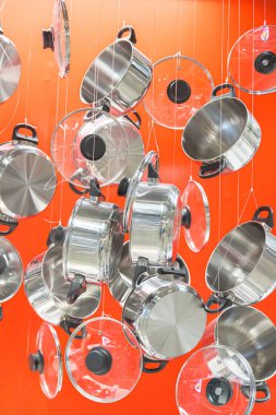 Cookware set in kitchenware on a red background
