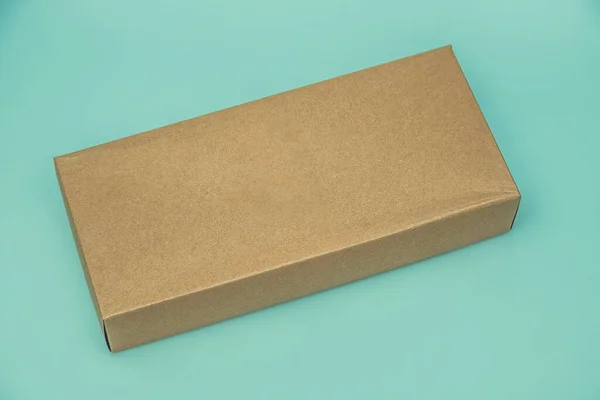 Empty Cardboard Box isolated on a green background