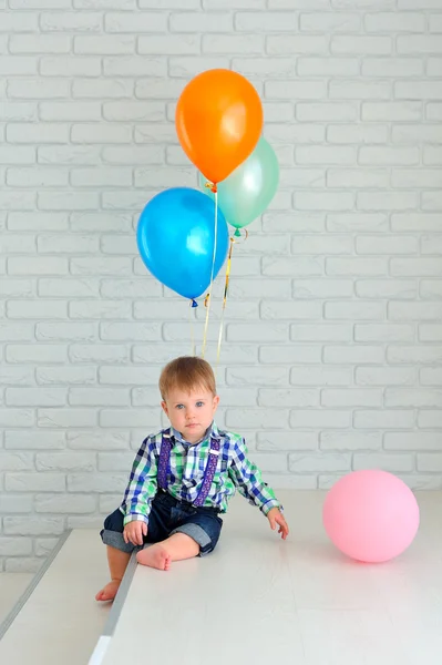 Boy with colorful balloons — Stock Photo, Image