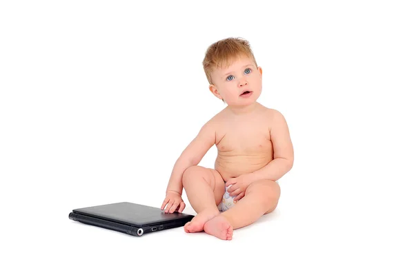 Small businessman sitting with a laptop, a child on a white back — Stock Photo, Image