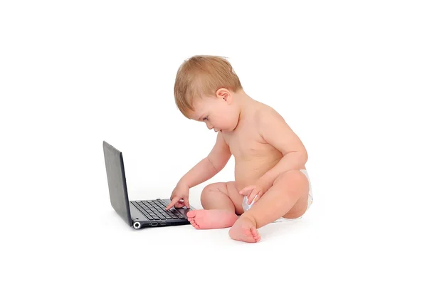 Small businessman sitting with a laptop, a child on a white back — Stock Photo, Image