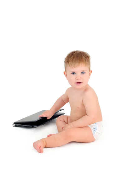 Small businessman sitting with a laptop, a child on a white back — Stock Photo, Image