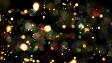 Altın rengi kahverengi bulanık bokeh ışığı. Soyut hareket arka planı altın parçacıkları parlıyor. Bokeh 'le parıldayan parçacıklar. Toz parçacıkları Siyah arkaplanda parlıyor.