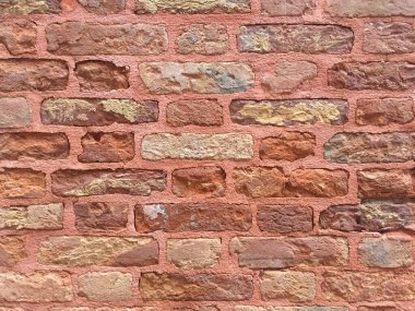 Görüntü ve grafikler için soyut tuğla duvar dokusu veya arkaplan. Gürültülü, kumlu ve posterli tuğla duvar eski ve eski moda bir desenle dokuyu kapat.