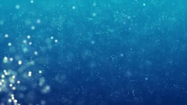 Blue color Delightful soft light bokeh and particles visuals with shallow depth of field. Abstract background with animation of flying and flickering particles as bokeh of light.