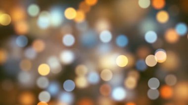Multi color Delightful soft light bokeh and particles visuals with shallow depth of field. Abstract background with animation of flying and flickering particles as bokeh of light.