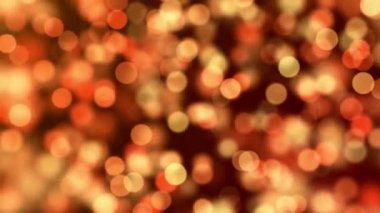 Golden color Delightful soft light bokeh and particles visuals with shallow depth of field. Abstract background with animation of flying and flickering particles as bokeh of light.
