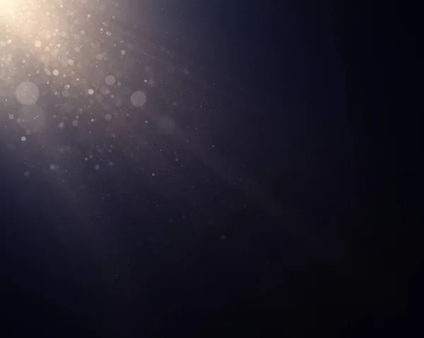 Defocused soft light and bokeh glitter lights background. Golden shimmering particles abstract bokeh glitter background. Abstract dust bokeh background.