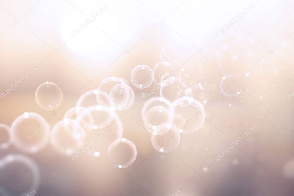 closeup of Defocused soft bubble bokeh over a shiny background. Light leaks overlay bokeh background. Real and organic camera lens flare leaks overlay image.