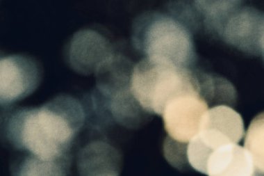 Abstract multi-color noisy and grainy soft light bokeh background. Natural and organic abstract night light background overlay. Glitter lights background. defocused. Light leaks optical flares overlay background.