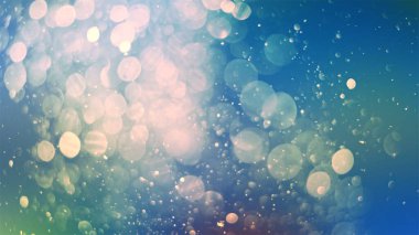 Defocused soft light and bokeh glitter lights background. Golden shimmering particles abstract bokeh glitter background iamge.