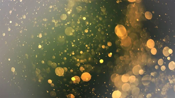 Defocused Soft Light Bokeh Glitter Lights Background Golden Shimmering Particles — Foto de Stock