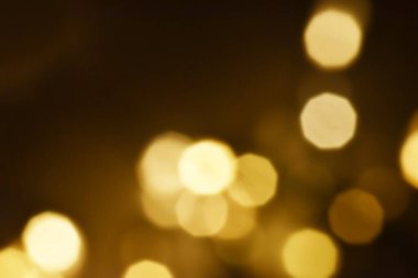 Golden bokeh soft light background. Golden glitter dust shiny sparkle bokeh abstract background overlay video.