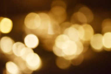 Golden bokeh soft light background. Golden glitter dust shiny sparkle bokeh abstract background overlay video.