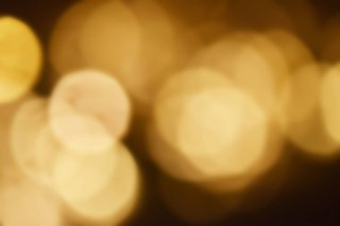 Golden bokeh soft light background. Golden glitter dust shiny sparkle bokeh abstract background overlay video.