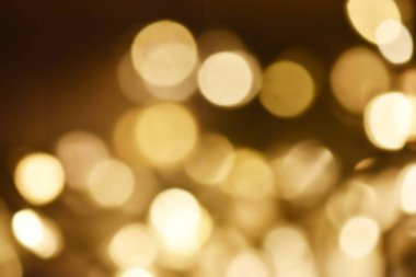 Golden bokeh soft light background. Golden glitter dust shiny sparkle bokeh abstract background overlay video.