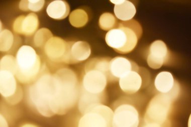 Golden bokeh soft light background. Golden glitter dust shiny sparkle bokeh abstract background overlay video.