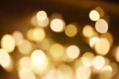 Golden bokeh soft light background. Golden glitter dust shiny sparkle bokeh abstract background overlay video.