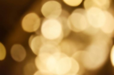 Golden bokeh soft light background. Golden glitter dust shiny sparkle bokeh abstract background overlay video.