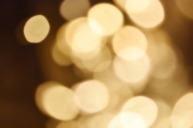 Golden bokeh soft light background. Golden glitter dust shiny sparkle bokeh abstract background overlay video.