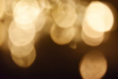 Golden bokeh soft light background. Golden glitter dust shiny sparkle bokeh abstract background overlay video.