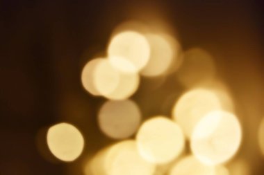 Golden bokeh soft light background. Golden glitter dust shiny sparkle bokeh abstract background overlay video.