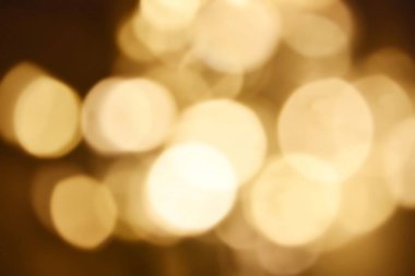 Golden bokeh soft light background. Golden glitter dust shiny sparkle bokeh abstract background overlay video.